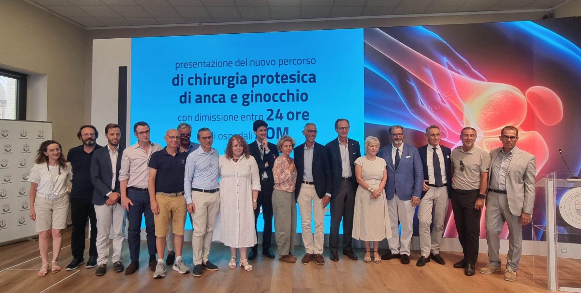 Dr. Pietro Memmo with orthopedic surgeons and healthcare leaders at the launch of the 24-hour hip and knee replacement program in Genoa, Italy